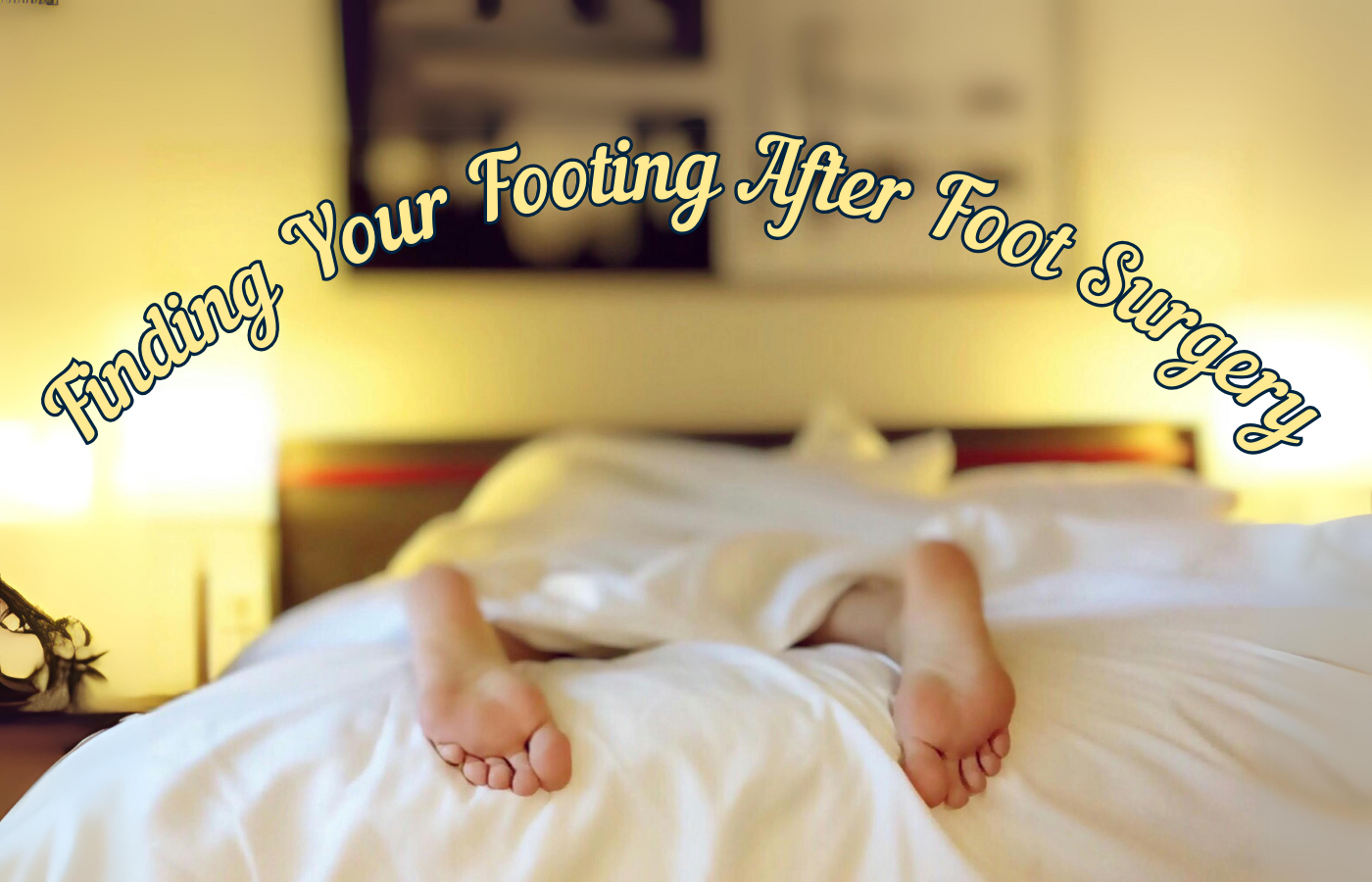 Person laying flat on stomach in bed with feet exposed